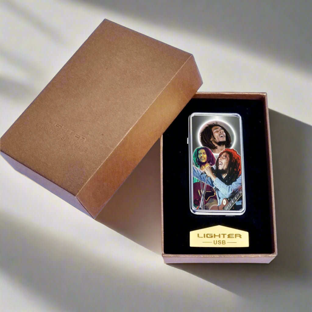 Lighter with a design of two people playing guitar in a box with a brown lid.