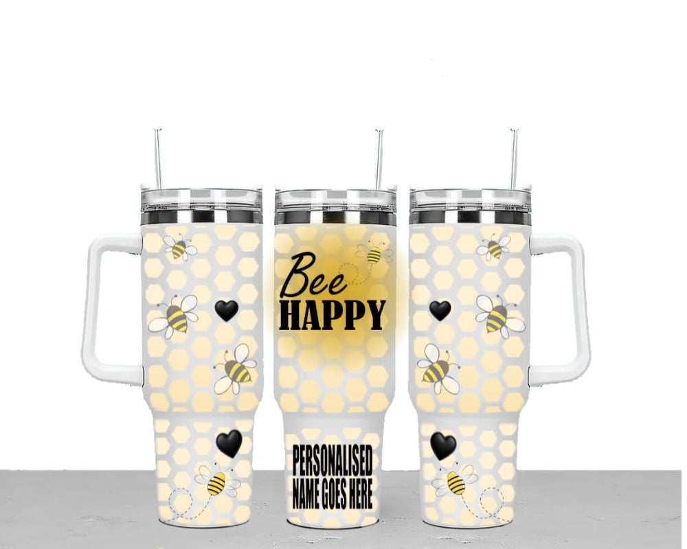 Three insulated tumblers with bee designs and text on a white background