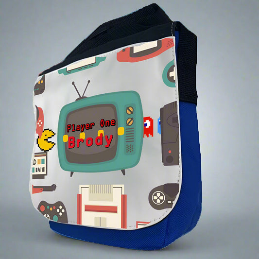 Sling bag with retro gaming design featuring a television and text on a white background