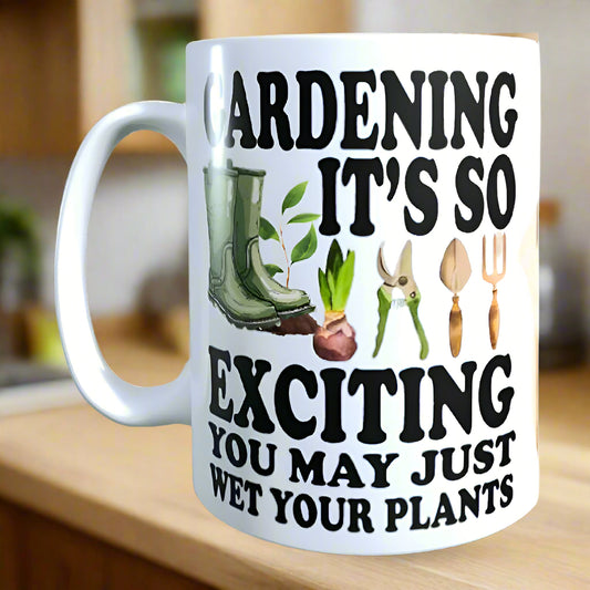 White mug with gardening-themed design and text on a wooden surface.