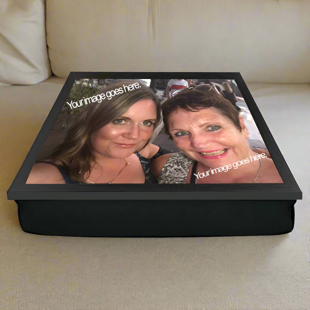 Personalized photo lap tray with two people's faces on a white background