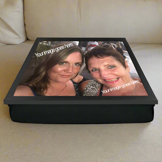 Personalized photo lap tray with two people's faces on a white background