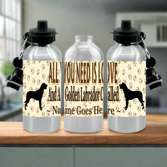 Three silver water bottles with dog-themed labels on a white background