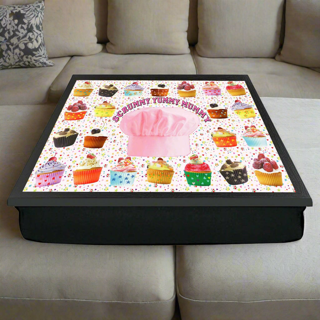 Cushion with colorful cupcake pattern and pink chef's hat on a white background