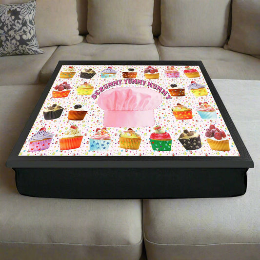 Cushion with colorful cupcake pattern and pink chef's hat on a white background