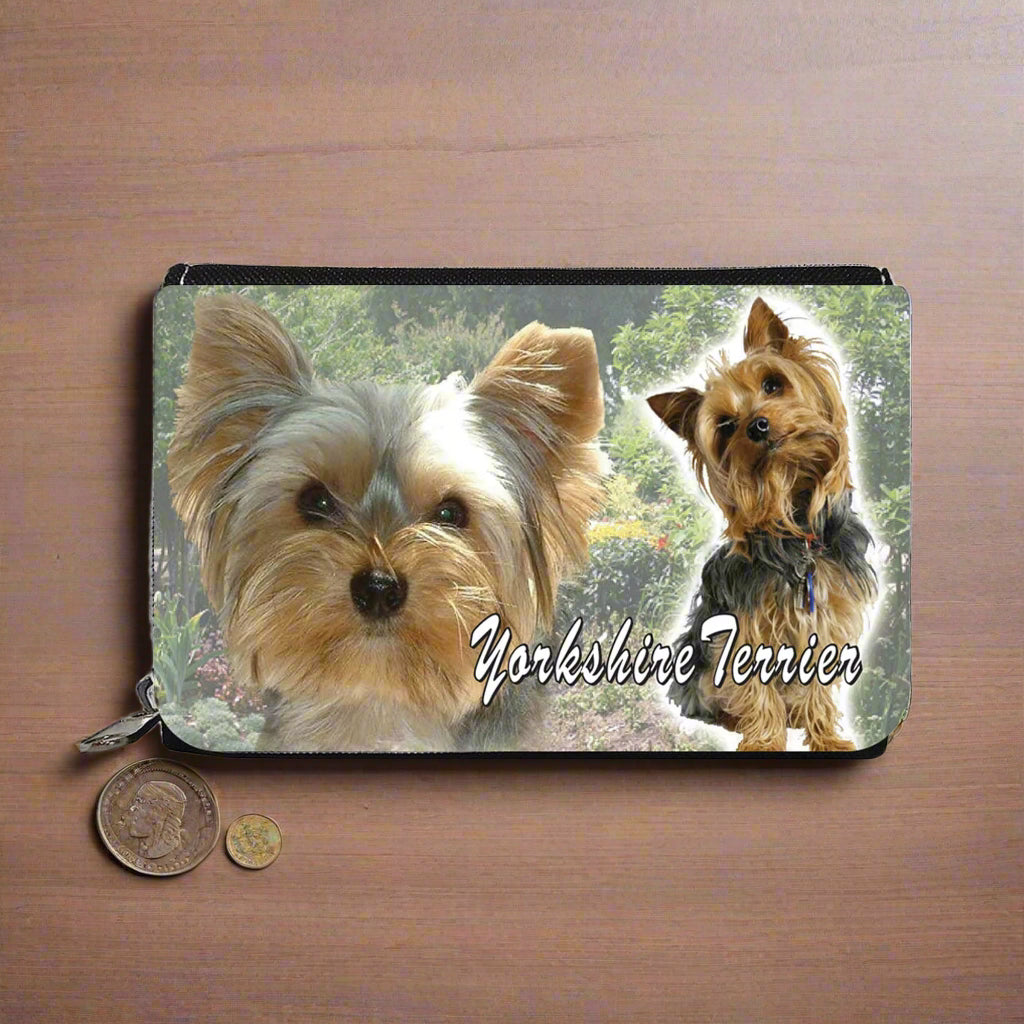 Purse with two Yorkshire Terriers on a nature background
