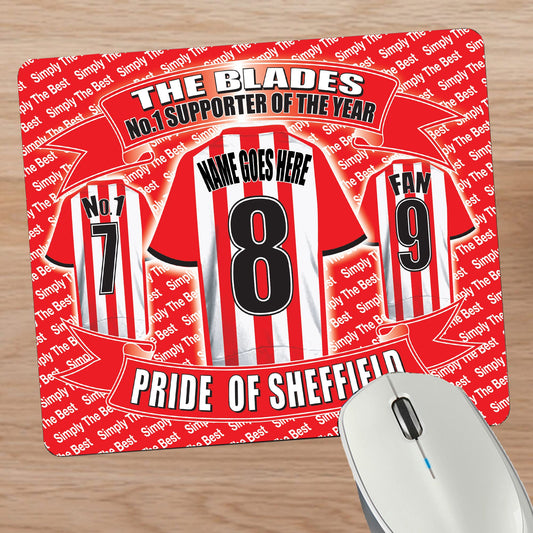 Mouse pad with sports team design and text on a wooden surface