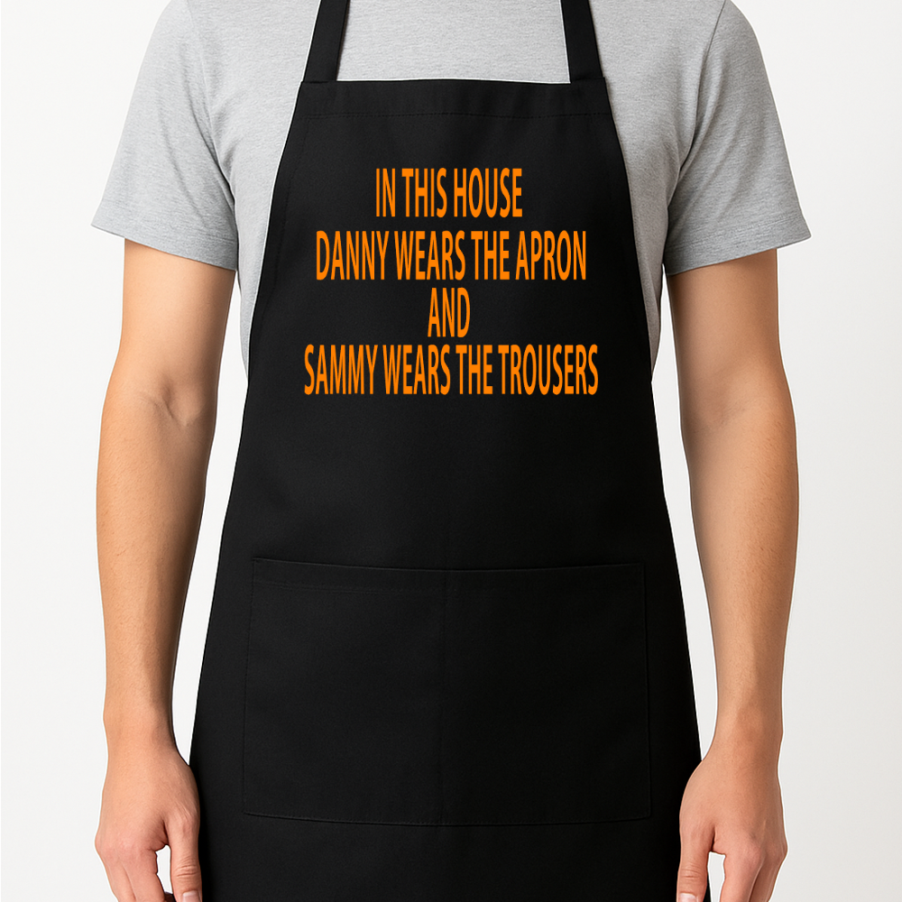 In This House (Name) Wears the Apron And (Name) Wears the Trousers Personalised Apron Gift Present Barbeque